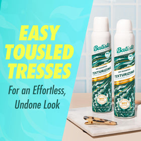 Batiste bottle held in hand to show 3.81 oz size and portability