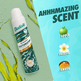 Batiste sprayed at hair roots showing oil absorption and lift