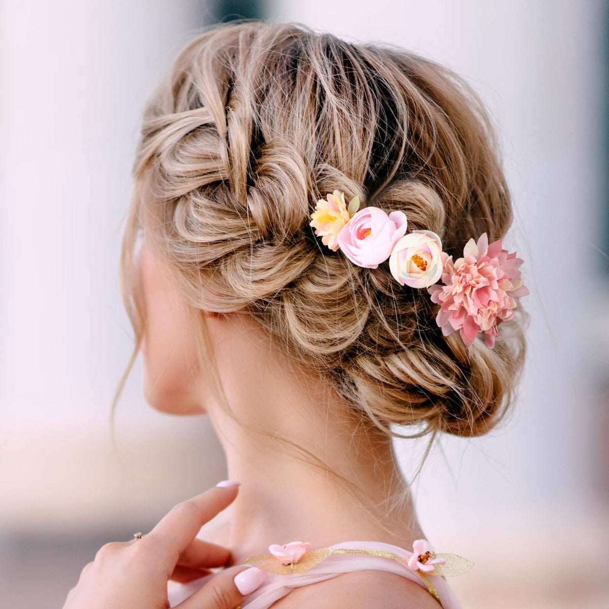 BBTO cluster of clips securing a low updo with durable hold for wedding wear