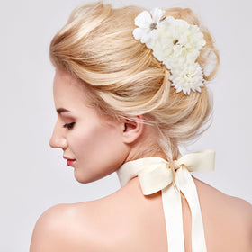 BBTO styled bridal updo featuring multiple clips for romantic accents