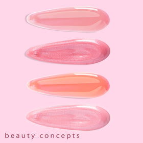 B.C BEAUTY CONCEPTS gloss tube in hand to show compact travel-friendly size and portability