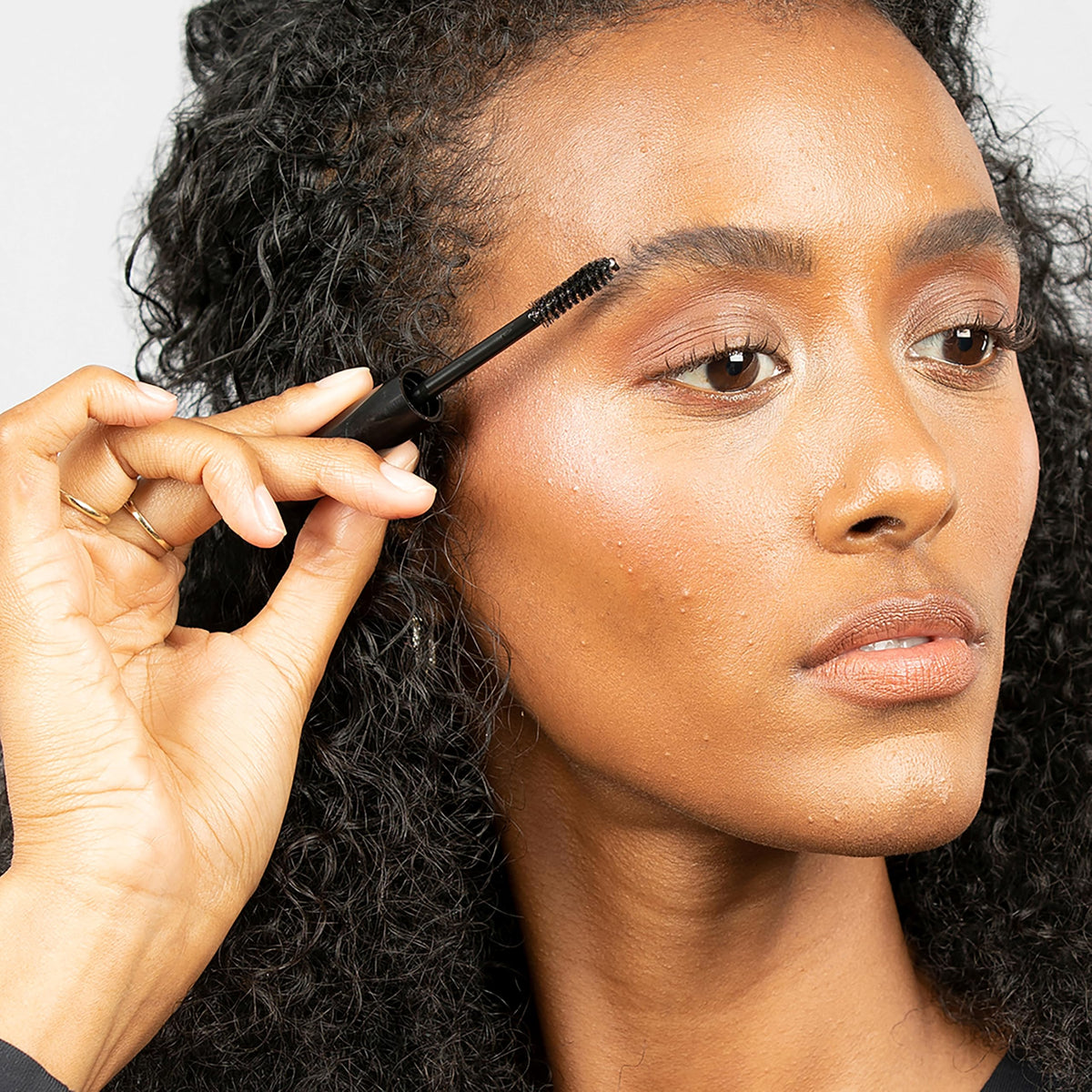 billion dollar brows tube in hand size comparison conveys travel-friendly convenience