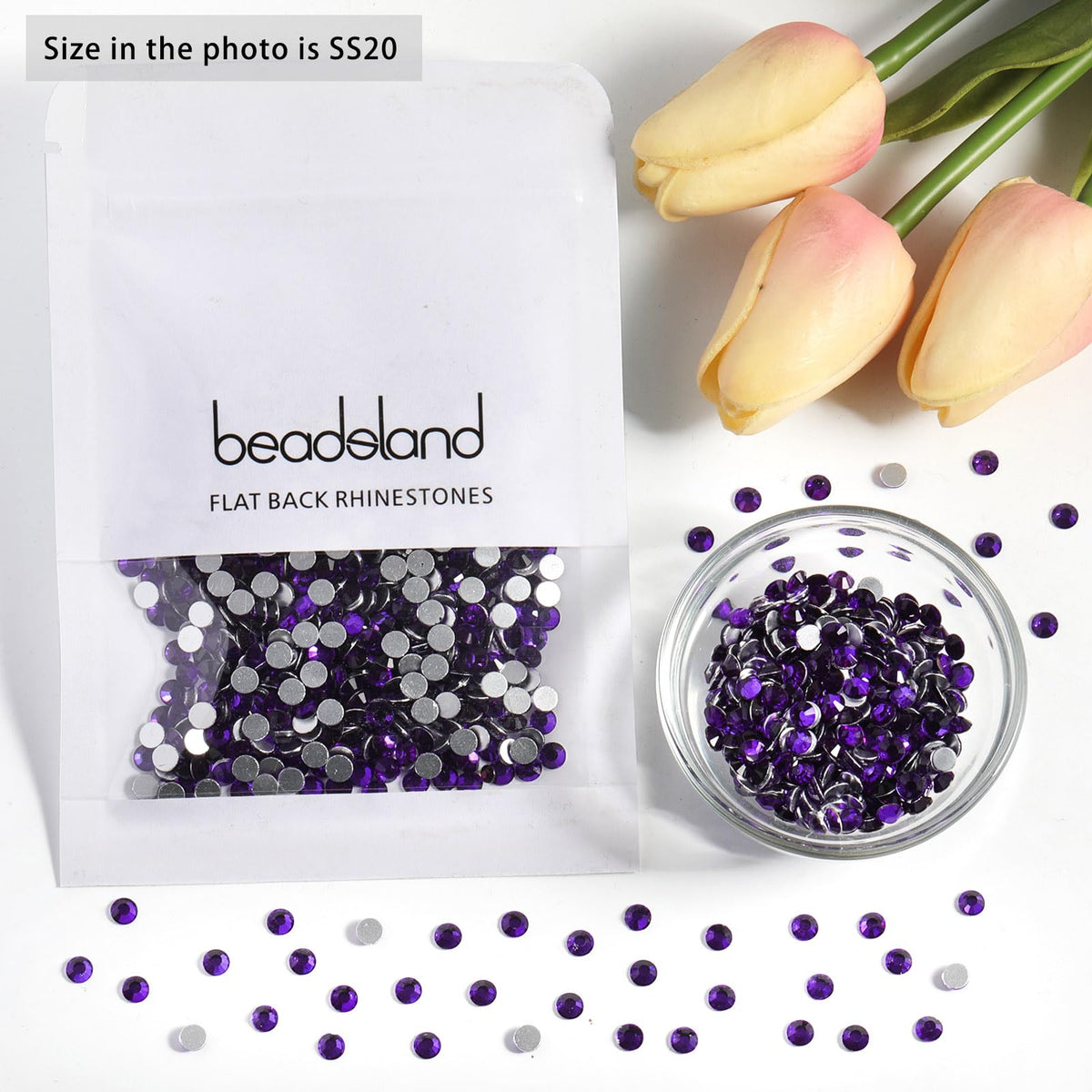 BEADSLAND rhinestones next to a coin showing SS20 size for accurate scale and planning