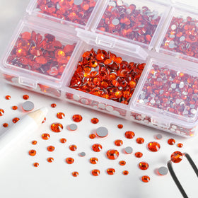 BEADSLAND tweezers and wax pencil with rhinestones ready for placement, improving precision