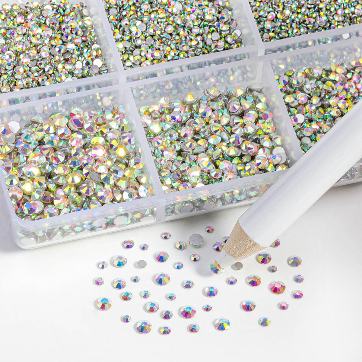 BEADSLAND wax picking pencil next to stones for precise placement and faster application