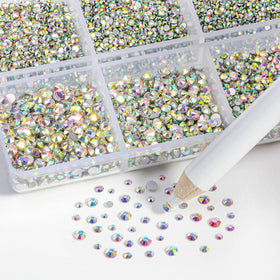 BEADSLAND wax picking pencil next to stones for precise placement and faster application