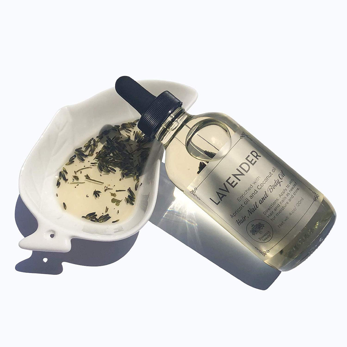 BEAUTE DE PROVENCE bottle beside apricot and almonds highlighting nourishing ingredients