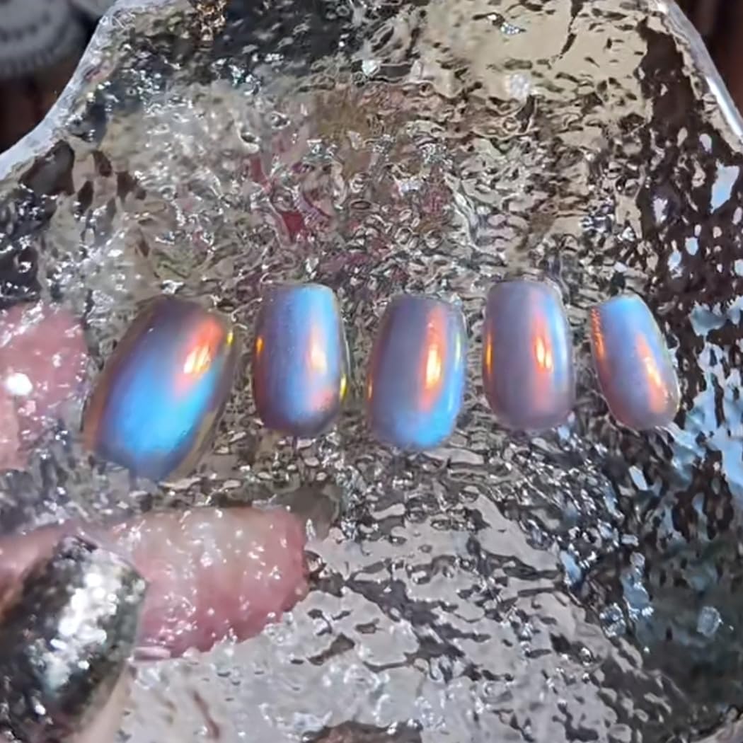 BEAUTNICE jar next to fingers showing scale and economical coverage benefit