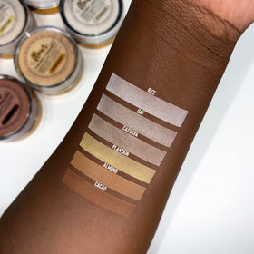 Beauty Bakerie brush pressing powder into skin for long-lasting matte finish