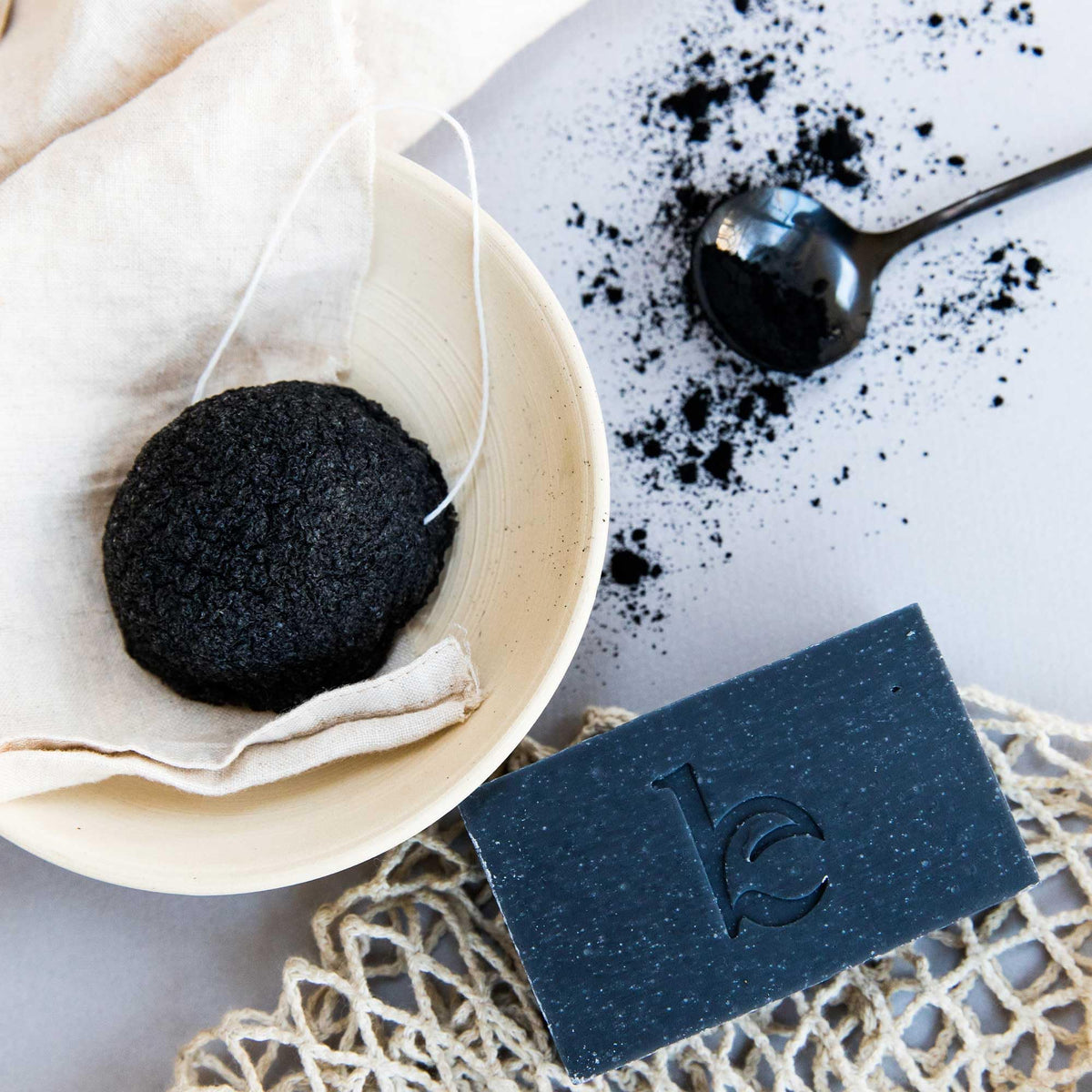 Beauty by Earth sliced cross-section of bar revealing charcoal speckled interior for detox