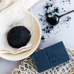 Beauty by Earth sliced cross-section of bar revealing charcoal speckled interior for detox