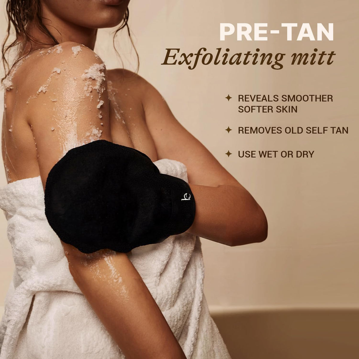 Beauty by Earth mitts in use applying self-tanner to arm for smooth coverage