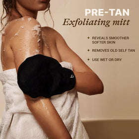 Beauty by Earth mitts in use applying self-tanner to arm for smooth coverage