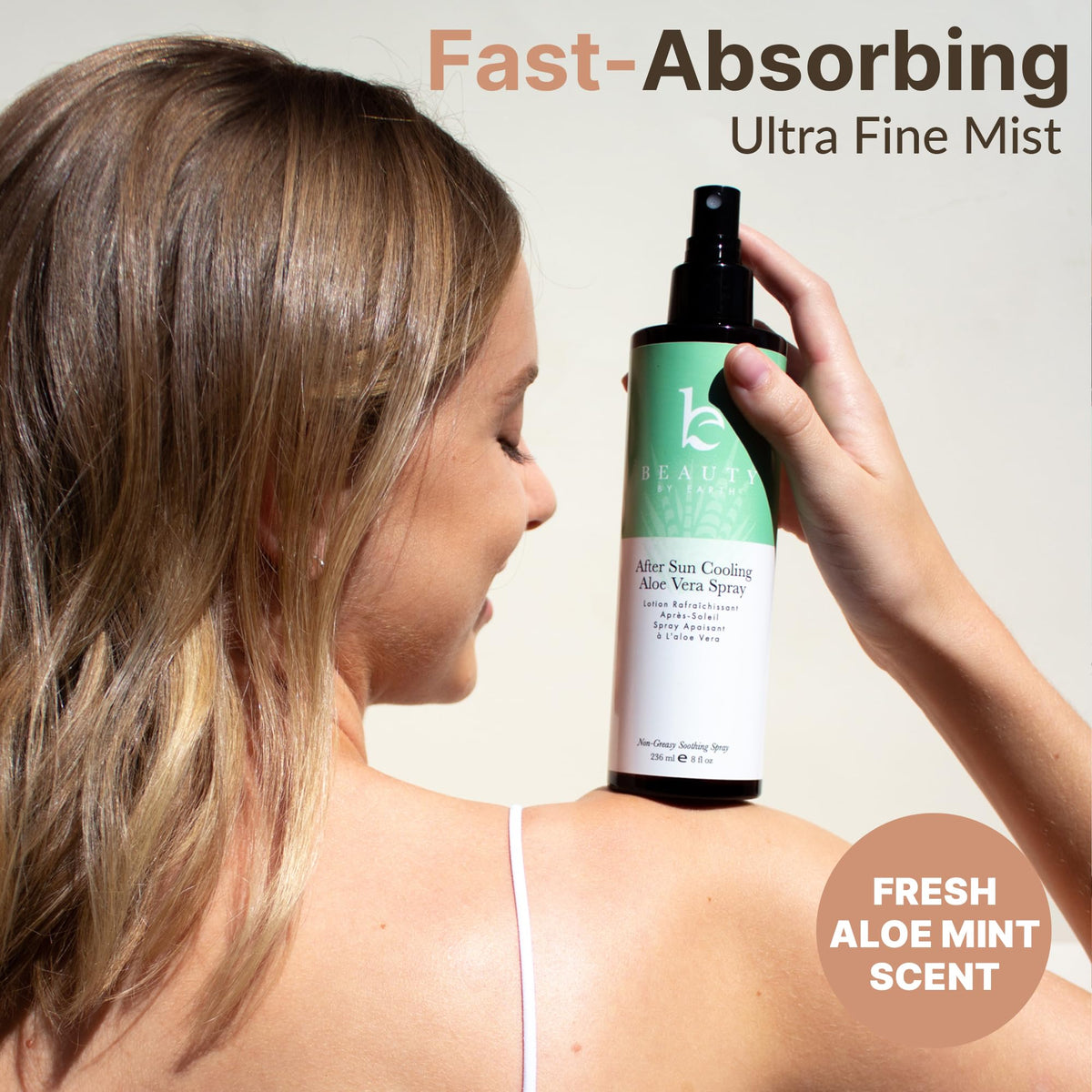 Beauty by Earth bottle in hand demonstrating portable after-sun relief