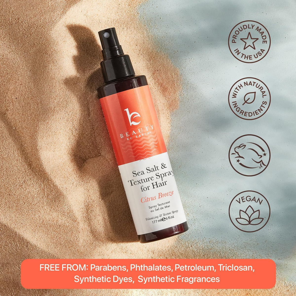 Beauty by Earth bottle in hand showing 6oz scale for travel-friendly use