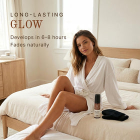 Beauty by Earth bottle next to hand to show actual product size