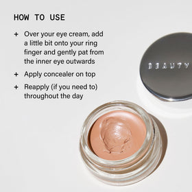 Beauty Pie 4ml size next to coin to show travel-friendly scale