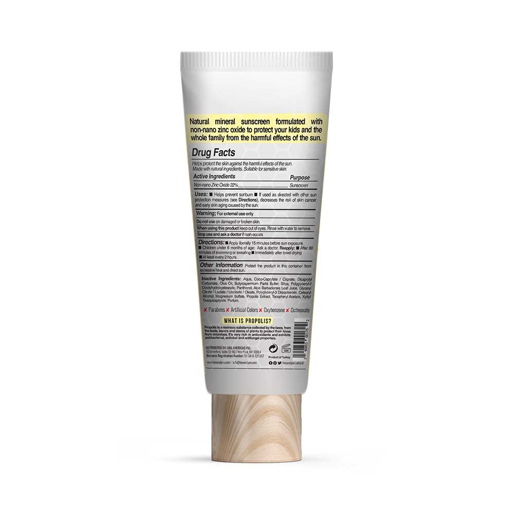 BEE & YOU sunscreen in a family beach scene protecting kids during outdoor play