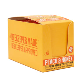 Beekeeper Made lip balm applied on lips in outdoor setting for protective moisturizing benefit