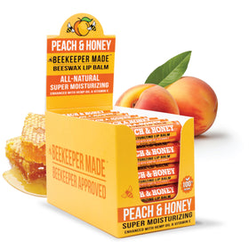 Beekeeper Made peach lip balm front packaging shows tube and label, natural hydration benefit
