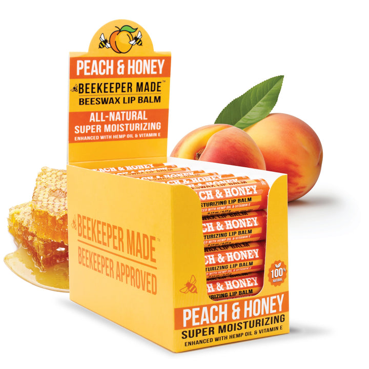 Beekeeper Made peach lip balm front packaging shows tube and label, natural hydration benefit