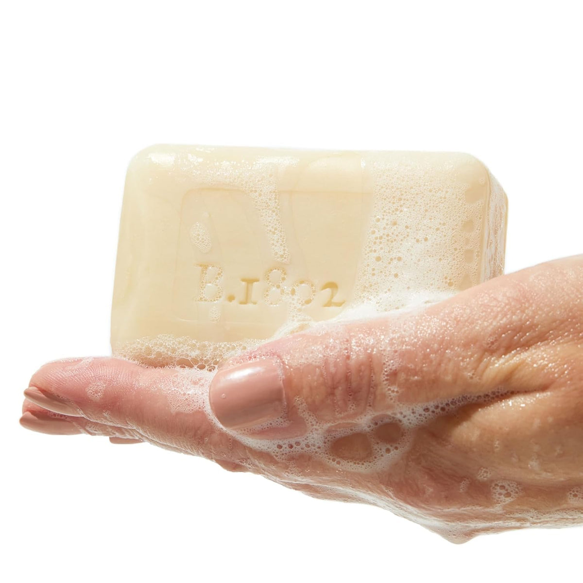 Beekman 1802 close-up of bar producing rich lather for moisturizing cleanse
