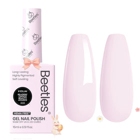 Beetles nails styled with summer outfit showing wearable soft pink shade