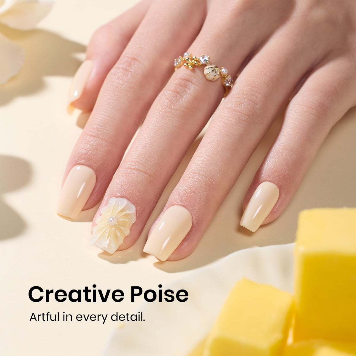 Beetles on-hand model wearing yellow nails for a summer-ready look