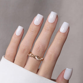 beetles hand model wearing short square nails for a natural polished look