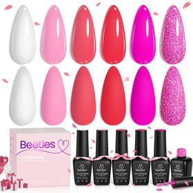 Beetles lifestyle image of summer manicure on hands near flowers showing wearable looks benefit seasonal style