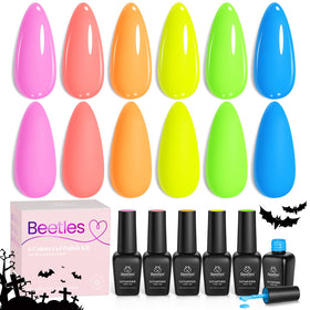 Beetles Gel Polish on nails at poolside showing vibrant summer-ready manicure