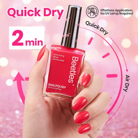 Beetles painted fingernails in neon pink demonstrating vibrant everyday look