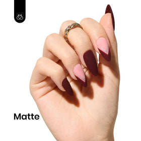 Beetles Gel Polish merlot wine on model nails in lifestyle scene for elegant evening look