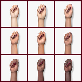 Beetles Gel Polish applied on a model nail showcasing rich maroon shine