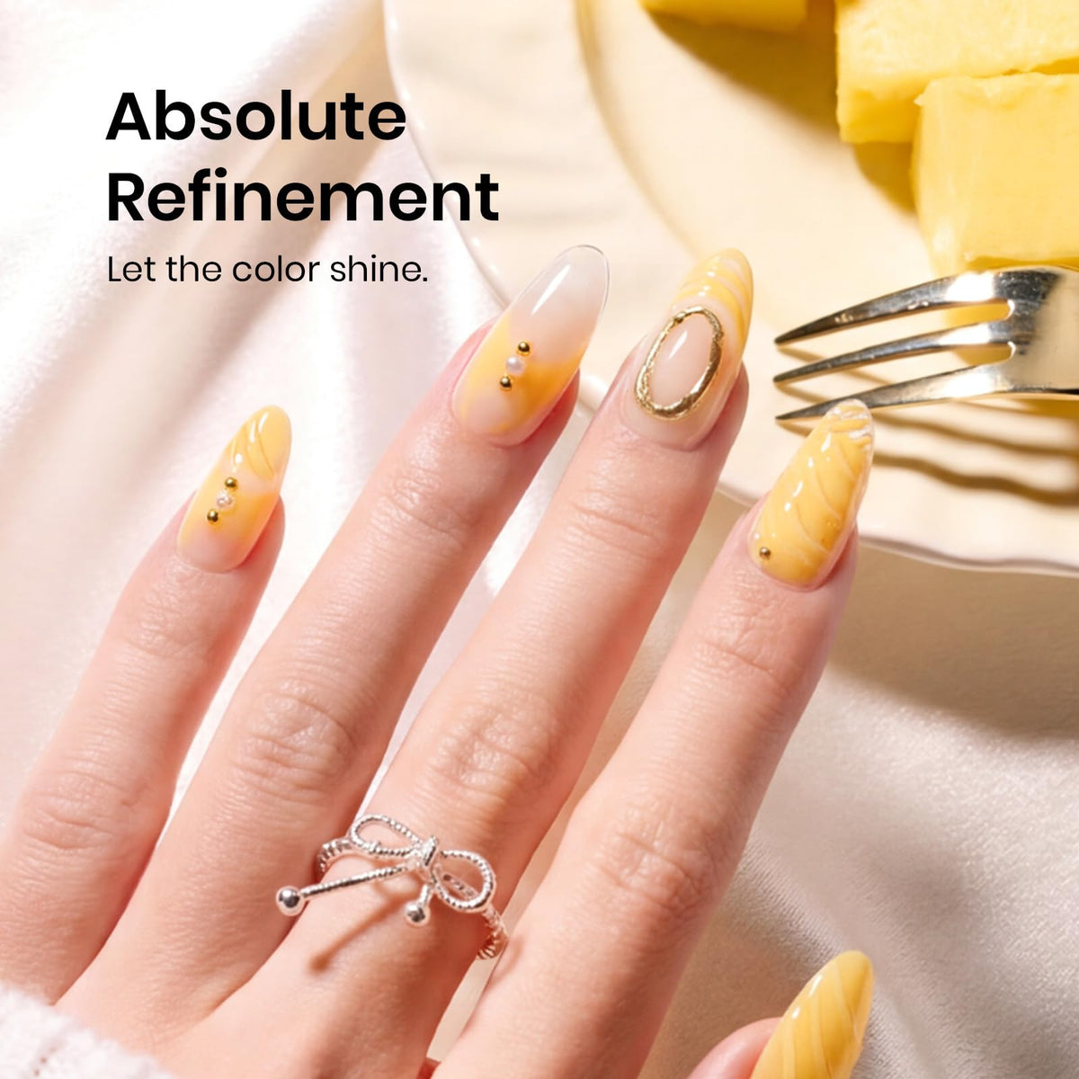 beetles plumeria yellow nail swatch on hand model showing glossy finish