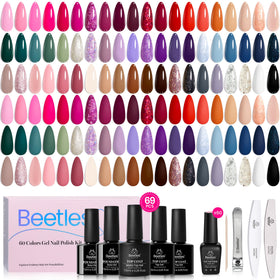 Beetles scale comparison bottle next to coin to show compact 5ml size for travel