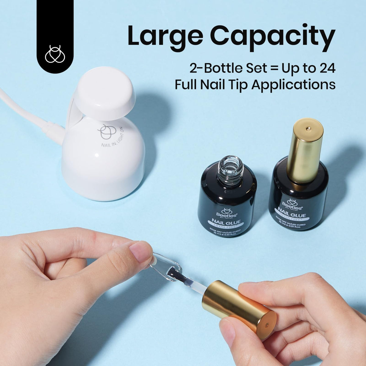 beetles gel polish two bottles in hand indicating 15ml size and many applications
