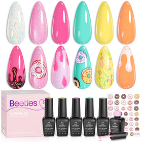 Beetles Gel Polish finished summer manicure on hand at picnic demonstrating cheerful look
