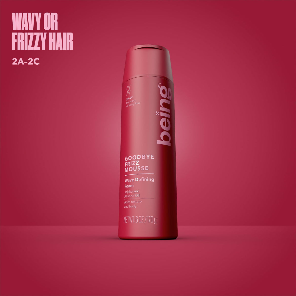BEING jojoba and almond oils next to mousse highlighting nourishment and shine