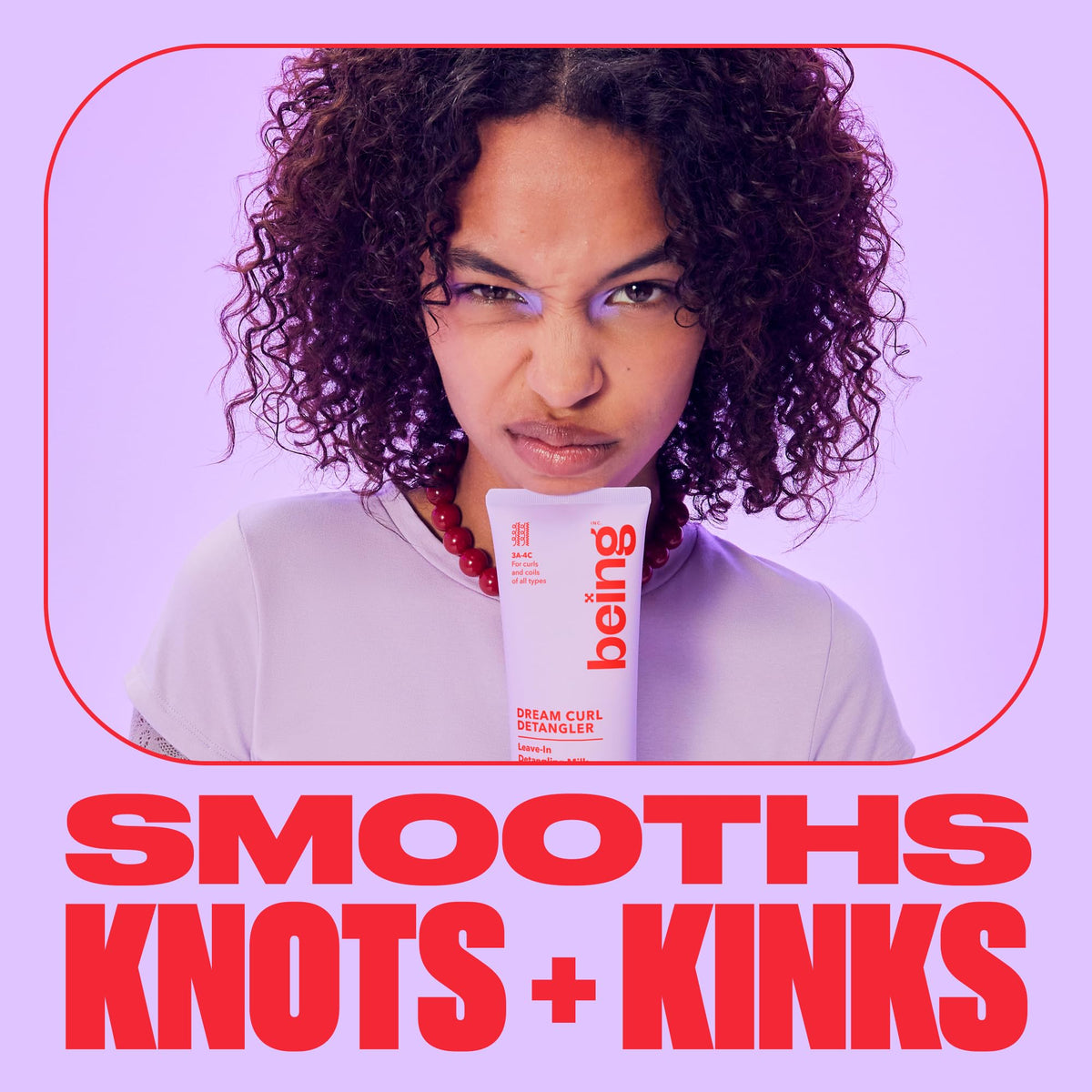 BEING INC being applied to damp curls demonstrating easier comb-through