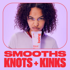 BEING INC being applied to damp curls demonstrating easier comb-through