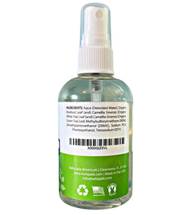 Bella Jade bottle beside green tea leaves showing antioxidant benefit