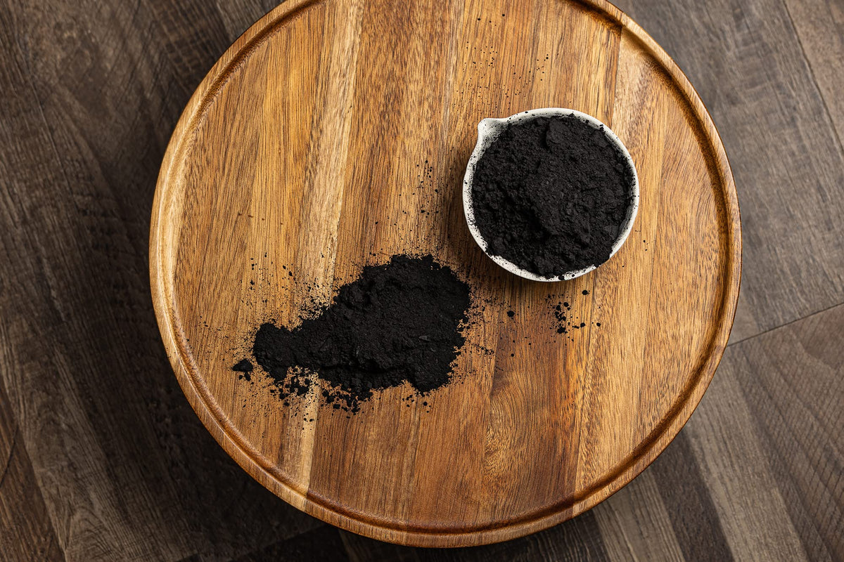 Belle Chemical charcoal blended into soap batter illustrating color contrast and formulation use