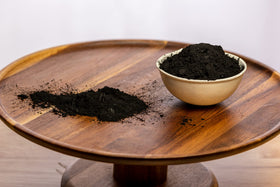 Belle Chemical scoop measuring powder to demonstrate correct portioning for safety and consistency