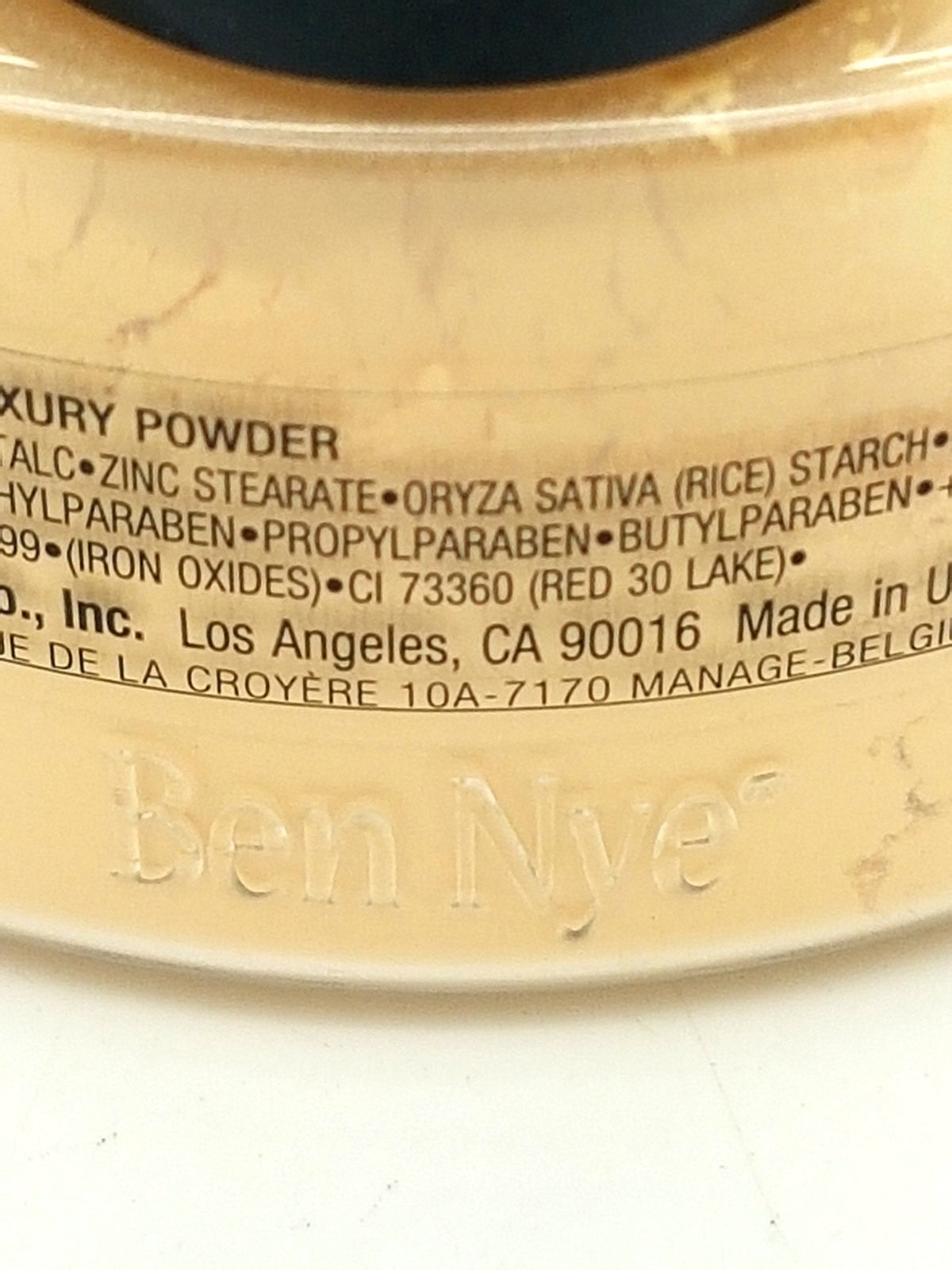 Ben Nye banana powder application lifestyle model using brush for long-lasting matte