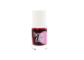 Benefit benetint next to common travel items showing compact 0.33 oz portability