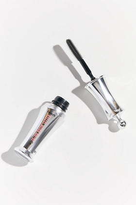 Benefit Brow Setter next to a coin for scale showing compact 0.11 fl oz travel size