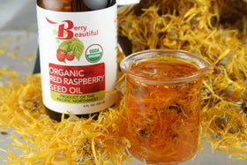 Berry Beautiful bottle styled with fresh raspberries for natural sourcing benefit