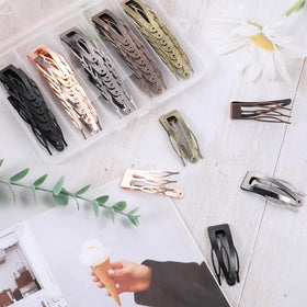 BESARME clips shown on a hand for scale and portable convenience