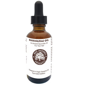 Best Nature's Bhringraj Oil next to a ruler showing 2 fl oz scale for travel-friendly size